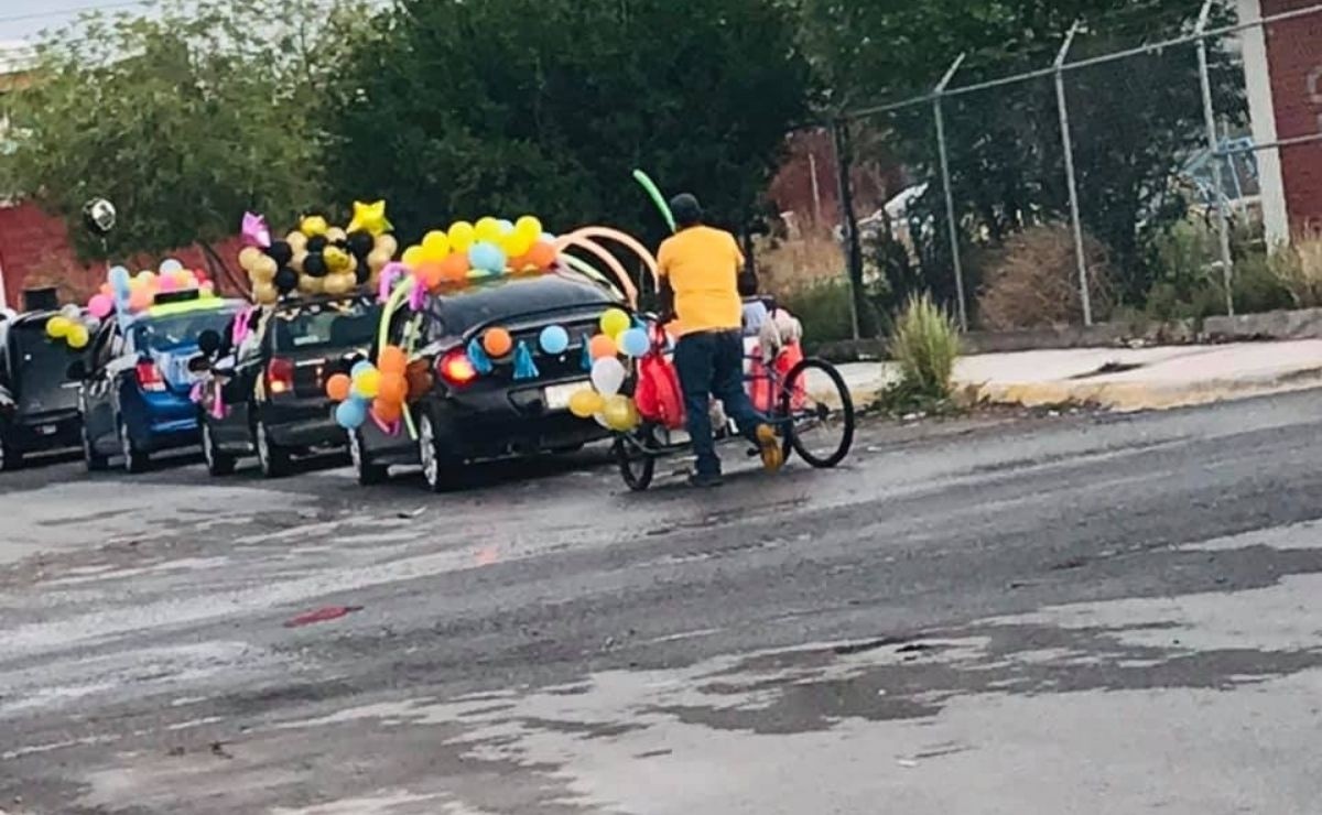 Father Takes His Son On Tricycle To Graduation Caravan