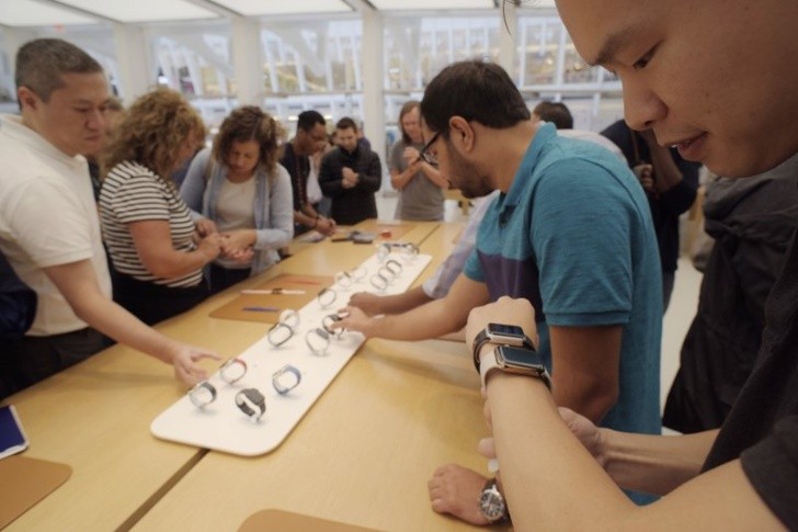 People looking at Apple Watches in an Apple store in New York. (AP Photo/Patrick Sison