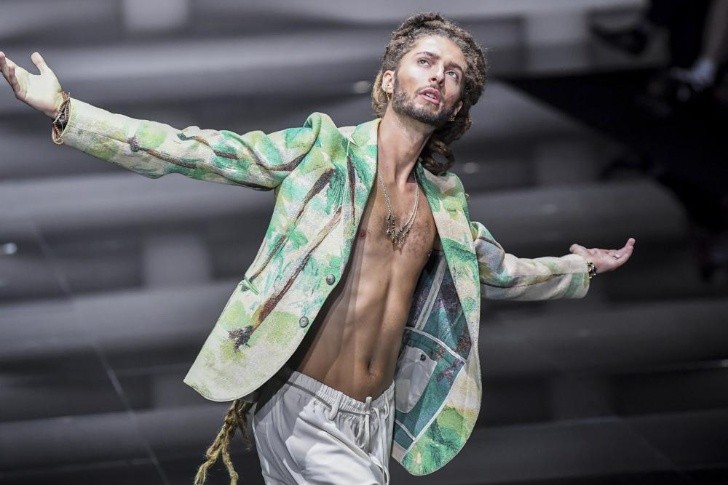 A model wears a creation as part of the Emporio Armani Spring Summer 2023 menswear collection presented in Milan, Italy, Saturday, June 18, 2022. (AP Photo/Nicola Marfisi)